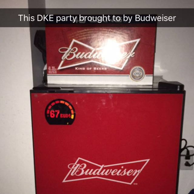 Red Budweiser refrigerator with a Budweiser sign above it on a plain background