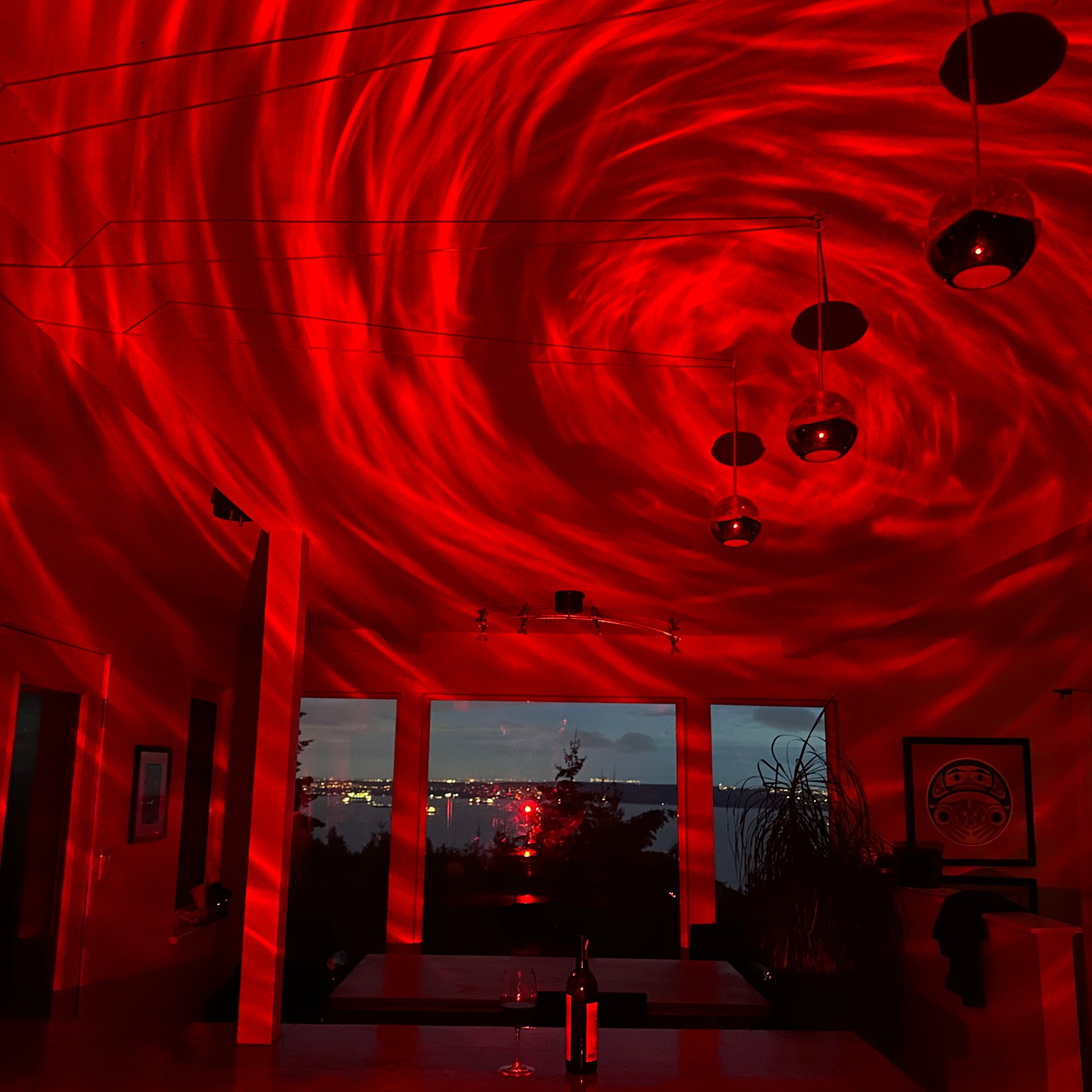 Red interior design with circular patterns and reflective surfaces