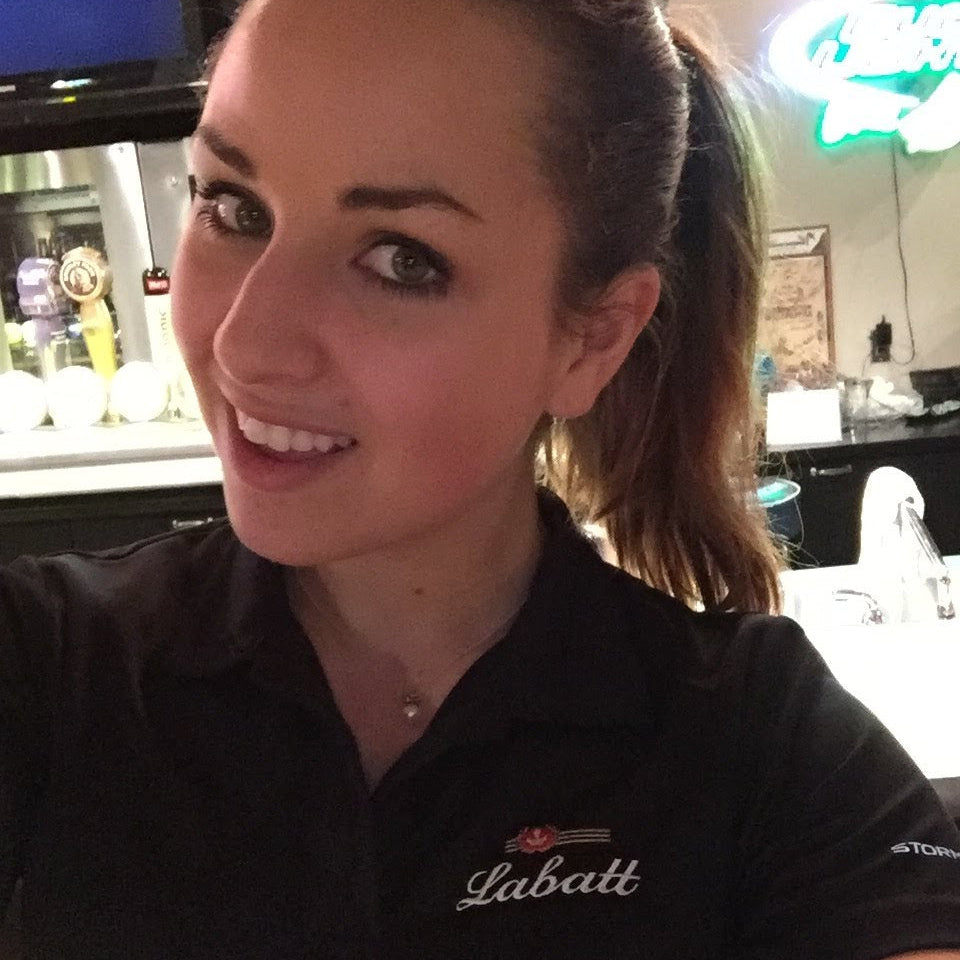 Person wearing a black Labatt shirt in an indoor setting